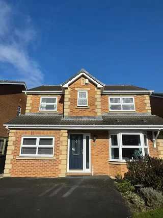 A large detached house with a driveway
